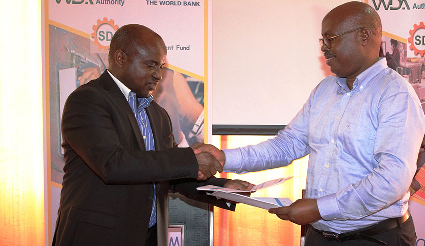 DG of WDA Eng Pascal Gatabazi and Jerome Mugabo ,DG of Kigali Garment Centre. Michel Nkurunziza.