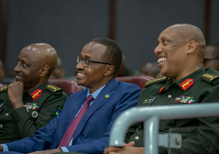 Defence Minister, Major General Albert Murasira (C) shares a light moment with Chief of Defence Staff General Patrick Nyamvumba (R) and Major General Jean Bosco Kazura at the Symposium(Courtesy)
