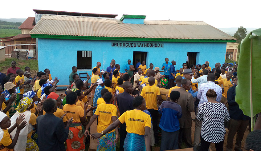 Residents of Nkondo celebrate at the village offices they have built themselves. JD Nsabimana.