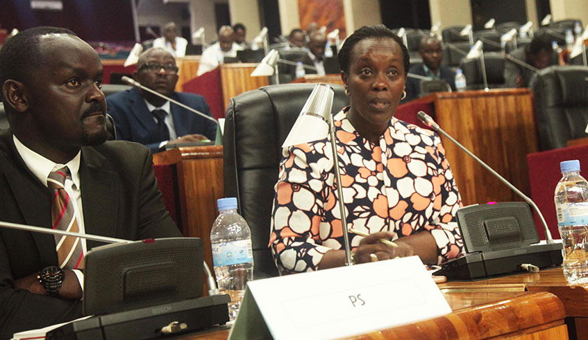 The Minister for Health Dr Diane Gashumba (right) addresses Members of Parliament as Permanent Secretary Jean-Pierre Nyemazi looks on Monday. Sam Ngendahimana.