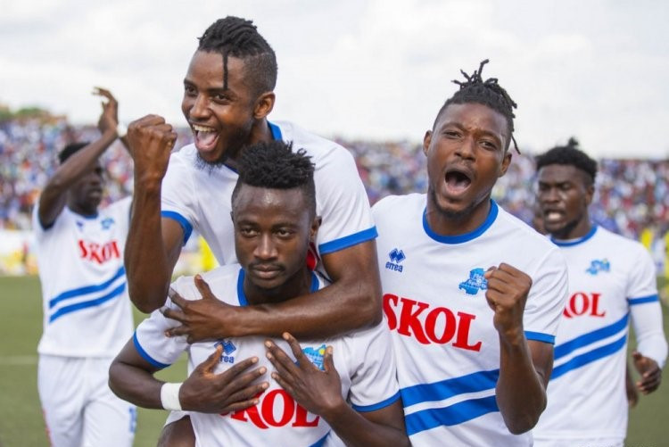 Scoring machine Jules Ulimwengu carries midfielder Fabrice Mugheni as they celebrated Rayon Sportsu2019 3-1 win against AS Muhanga last month. On the right is Ghana-born forward Prosper Kuka Donkor. / Courtesy