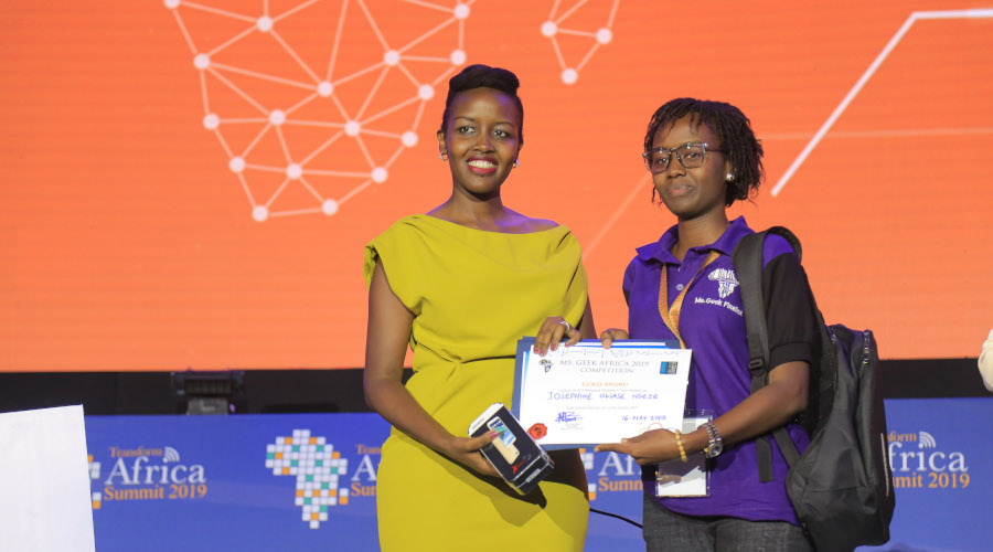 The Minister of ICT and Innovation Paula Ingabire awarding Josephine Uwase Ndeze, the winner of Miss Geek Africa 2019, in Kigali yesterday. / Nadege Imbabazi