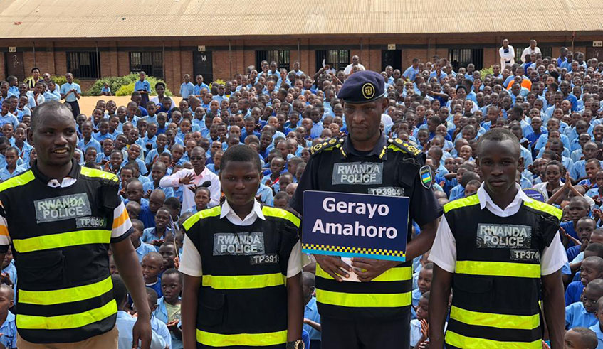 CP Bruce Munyambo with teachers and students from GS Kagugu in Gasabo district,Courtesy