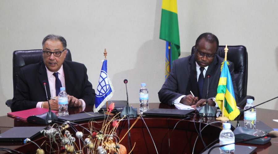 Minister for Finance and Economic Planning Uzziel Ndagijimana, and World Bank Vice President for Africa Region, Hefez Ghanem, sign the agreement in Kigali yesterday. / Craish Bahizi