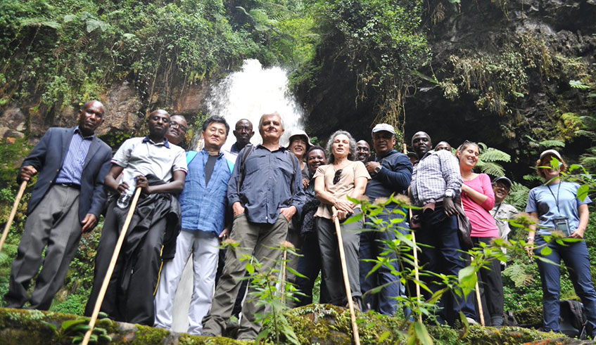 Members of the Diplomatic Corps pose for a photo in front of the magnificent Kamiranzovu waterfalls.