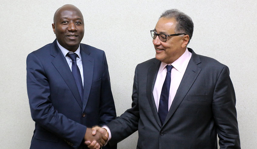 Prime Minister Edouard Ngirente (L) shakes hands with Hafez Ghanem, the Vice President of World Bank for Africa at his office in Kimihurura. (Courtesy)