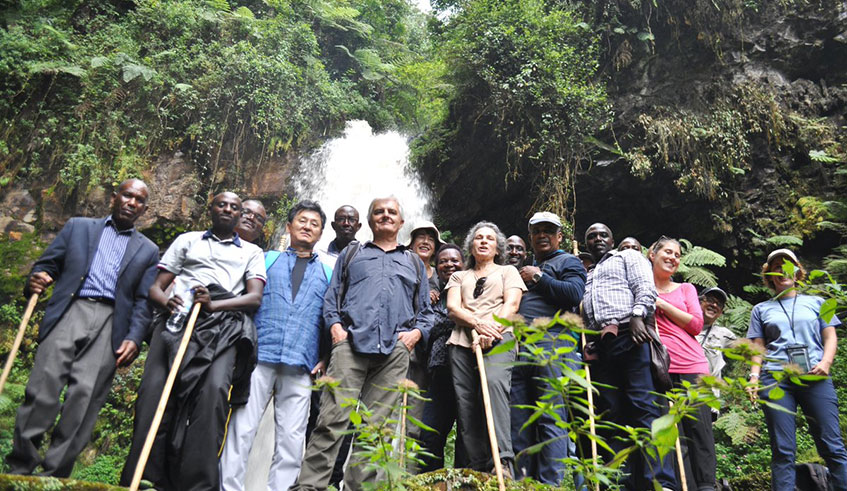 Members of the Diplomatic Corps pose for a photo in front of the magnificent Kamiranzovu Waterfall in Nyungwe National Park. Courtesy photos.
