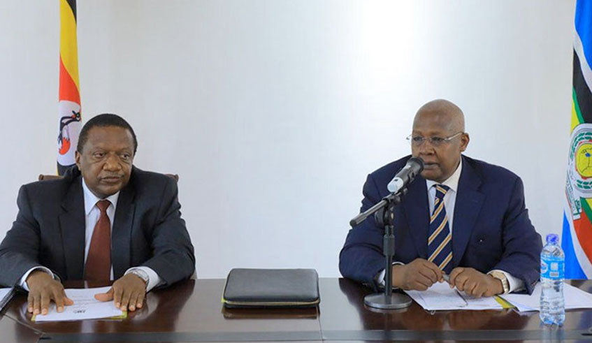 Ugandau2019s Foreign affairs minister Sam Kutesa (right) and PS Patrick Mugoya during the meeting with the diplomatic corps in Kampala on Friday. Net photo.