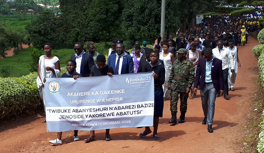 Students from seven schools across Gakenke District and officials during in a Walk to Remember yesterday in honour of teachers and students killed in the Genocide. Photos by Ru00e9gis Umurengezi.