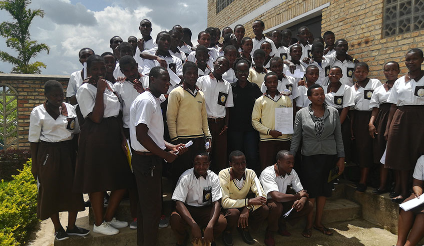 Ella Ishimwe,in the middl,e with other students at Padri Vjeko Center,a TVET school in Muhanga District after a career guiding event. Courtesy.