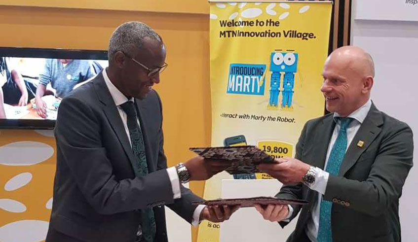 Stephen Ruzibiza, PSF Chief Executive Officer and MTN CEO Bart Hofker (right) signed the partnership agreement on behalf the two parties. Courtesy.