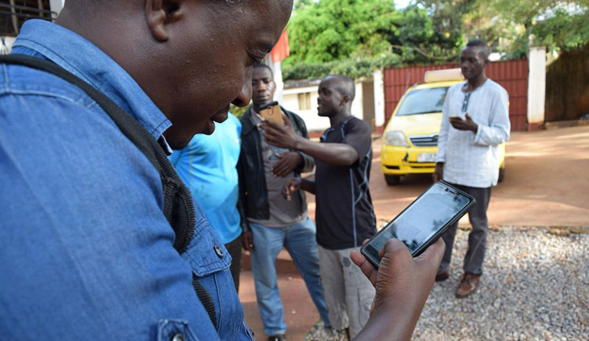A man uses Addressya mobile app on a smartphone. Net photo.