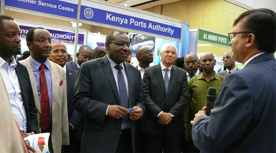 Rwandan Minister of Infrastructure flanked by Duncan Njage the Regional Marketing Director of ExpoGroup (in red tie) listen to one of the exhibitors at the event yesterday.