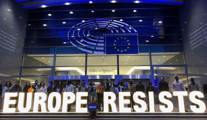 Activists display a banner outside the EU Parliament during the European Elections in Brussels, Belgium on May 26, 2019. Net photo.