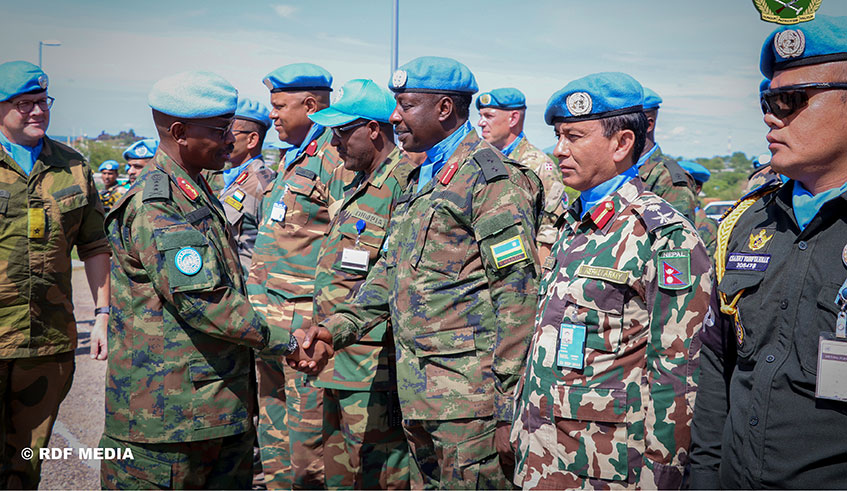 Lt Gen Frank Mushyo Kamanzi, the outgoing Force Commander of the United Nations Mission in South Sudan (UNMISS), bids farewell to senior officers serving under the Mission in Juba yesterday. He is seen here shaking hands with Col. Vincent Mugisha, the Contingent Commander of Rwandan peacekeepers. The Rwandan general returns home after successfully completing his two-year tour of duty as UNMISS Force Commander. He has been replaced by Indian Lt Gen Shailesh Tinaikar. Courtesy.