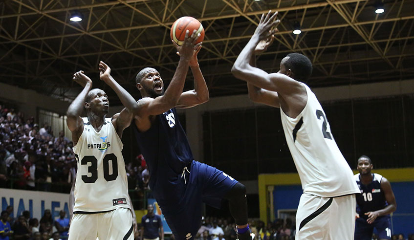 REG u2018s Kami Kabange finishes off a stylish lay-up during a past match against Patriots. Both teams will participate in this yearu2019s Genocide Memorial tournament. Sam Ngendahimana.