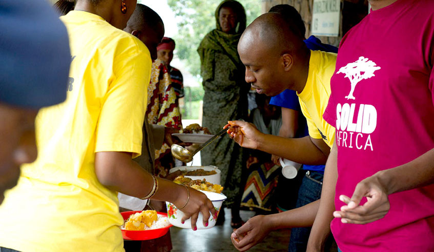 SolidAfrica members serve food to vulnerable people in hospitals. An act of kindness is seen as heroism. Net photo.