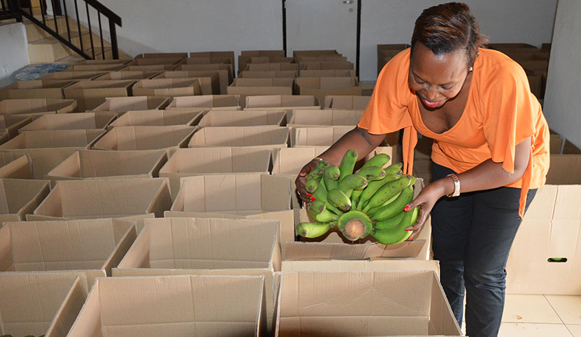 Business woman Donatille Nibagwire packs products ahead of export to the EU. Sam Ngendahimana.