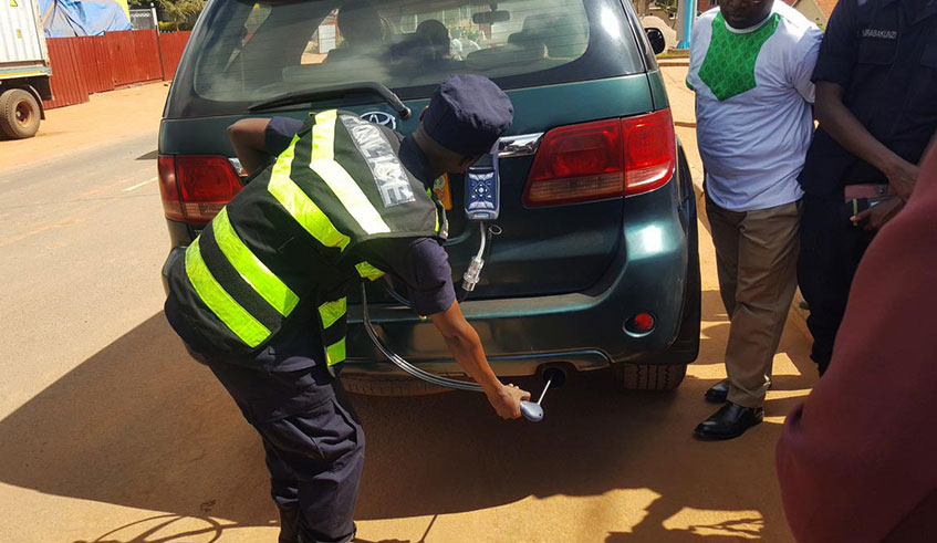 A police officer tests levels of emissions from a vehicle as part of a fresh campaign to raise public awareness on the dangers of air pollution, on Wednesday. Transportation is the largest single source of air pollution and a key contributor to climate change globally. Courtesy. 