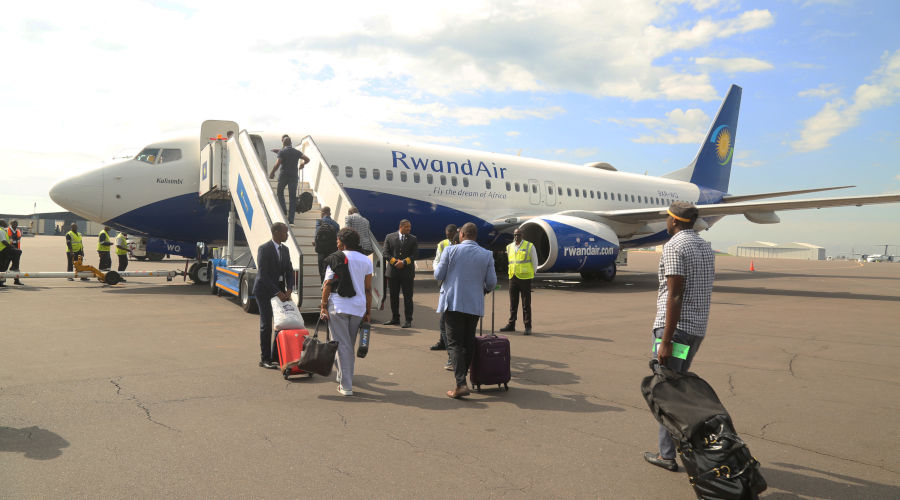 Passengers board a RwandAir aircraft. / Courtesy