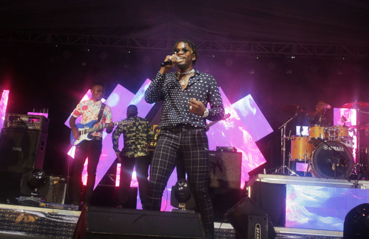 Amalon entertains revelers at the Kigali Exhibition Village. / Craish Bahizi