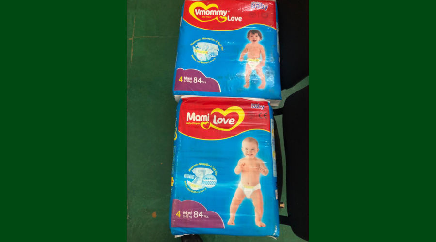 The products in contention. The original diaper product u2018Mami Loveu2019 (above) and the alleged imitation u2018Vmommy Loveu2019 (top). / Collins Mwai