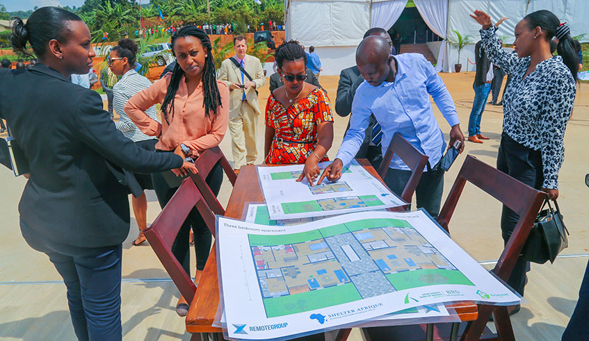 Participants look at the artistu2019s impression of the proposed estate at the site in Rugarama, Nyamirambo yesterday. Craish Bahizi.