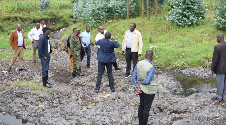 Northern Province governor, JMV Gatabazi and other officials in the province inspect one of the gullies that brings about flooding in Musanze District. / Ru00e9gis Umurengezi