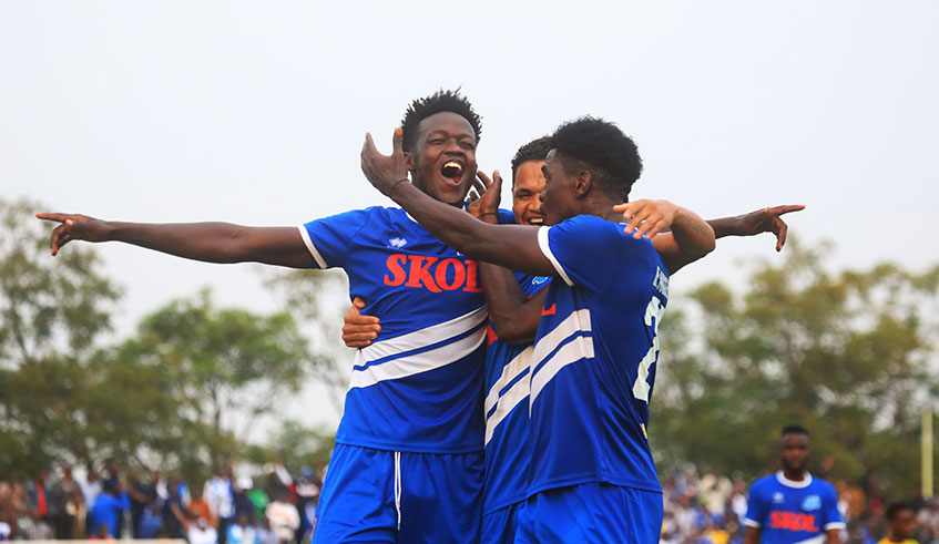 Ange Mutsinzi celebrates with Rayon Sports teammates Jonathan Rafael da Silva (C) and Hussein Habimana (R) after the lone goal that sank AS Kigali in Peace Cup on Tuesday. Sam Ngendahimana.