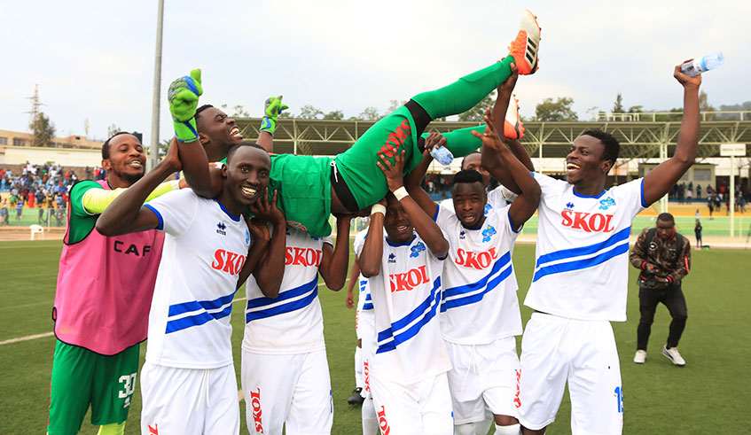Rayon Sports players lift goalkeeper Gerard Bikorimana in the air after beating AS Kigali 4-2 in penalty shootouts at Kigali Stadium on Friday. Sam Ngendahimana.