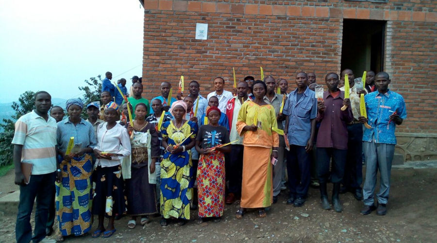 Some of the beneficiaries converge after receiving materials for their training sessions. / Courtesy