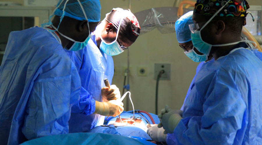 Prof Alexis Butera (centre) leads other doctors during an operation on a patient at King Faisal Hospital recently. / Sam Ngendahimana
