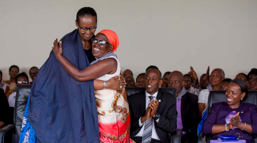 First Lady Jeannette Kagame hugs Azela Nyirangirumwami, one of the elderly genocide survivors, during the Kwibuka25 commemoration ceremony with Intwaza from Huye and Nyanza Impinganzima hostels in Huye District on Saturday. / Courtesy