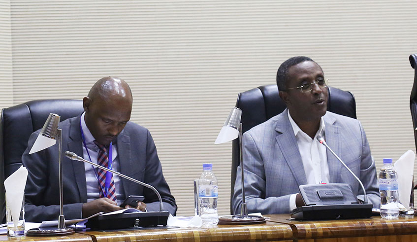 The Minister for Environment Dr Vincent Biruta (right) addresses Members of Parliament as REMA Deputy Director General Faustin Munyazikwiye looks on yesterday. The Lower House yesterday passed a draft law prohibiting the manufacture, importation, use and sale of single-use plastic items in Rwanda. Craish Bahizi. 