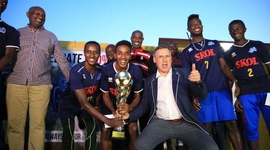 Skol Breweryu2019s General Manager Ivan Wulffaert gestures as Rayon Sportsu2019 players and officials celebrate their Azam Rwanda Premier League title at the breweryu2019s headquarters in Kigali on Friday. / Sam Ngendahimana