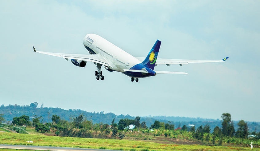 A RwandAir plane takes to the skies from the Kigali International Airport. File.