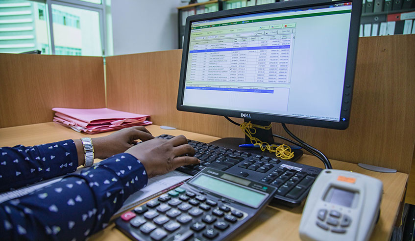 An accountant during tax declaration. Civil society wants more friendlier policies. Emmanuel Kwizera.