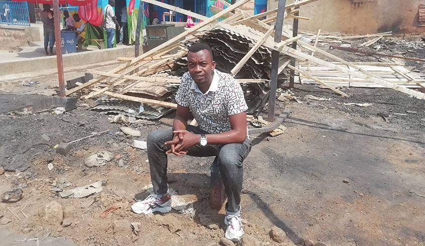 Emille Kalinda was yesterday found seated in the same spot where his  structures and workshop stood before they were consumed in a fire. Hudson Kuteesa. 