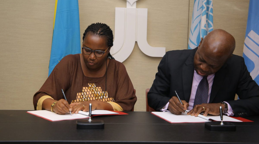 Agriculture Minister, Gerardine Mukeshimana and IFAD President, Gilbert F. Houngbo sign funding agreement between Rwanda and IFAD for Kayonza Irrigation and Integrated Watershed Management Project, in Italy, June 22, 2019. / Courtesy