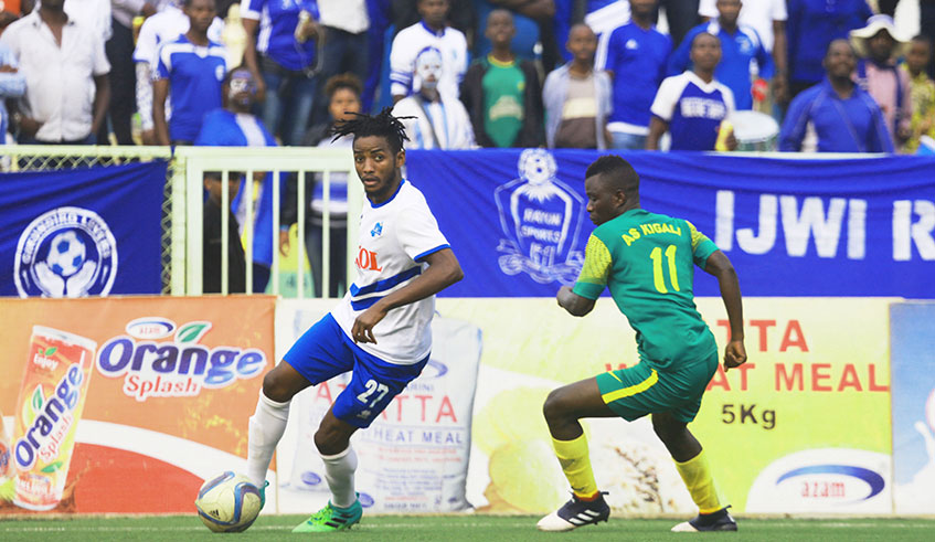 Midfielder Fabrice Mugheni, dribbling past AS Kigali striker Jean Claude Ndarusanze, scored Rayon Sports' opening goal during their 2-1 victory at Kigali Stadium on Wednesday. Sam Ngendahimana.