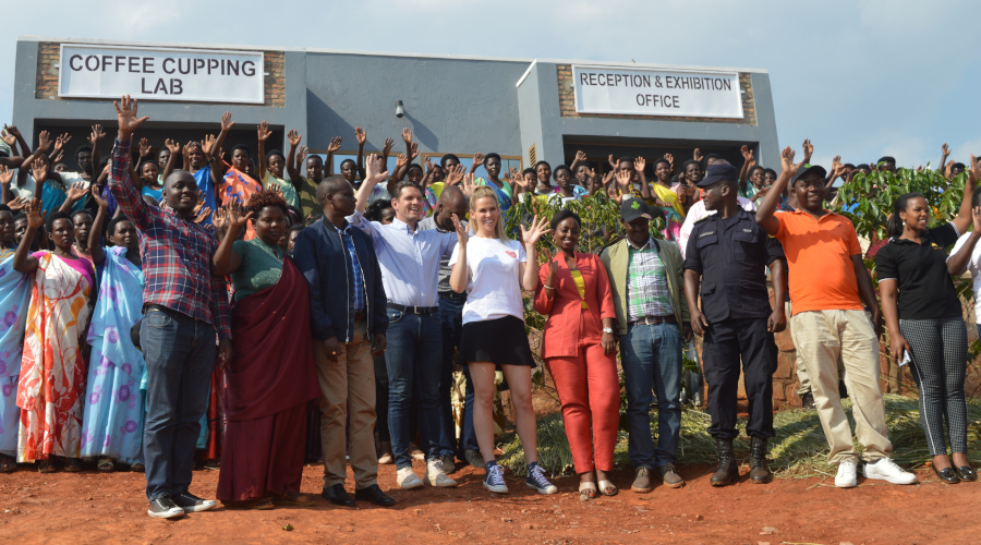 Women farmers and officials gesture in a group photo after the unveiling of the coffee cupping lab in Kayonza District. / Photos: Joseph Mudingu