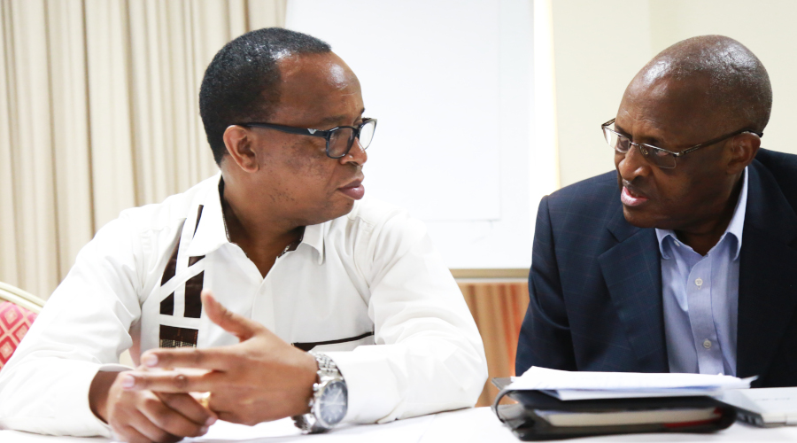 Dr Antoine Muyombano, Chairman of Rwanda Private Medical Facilities Association (right), interacts with his deputy Dr Dominique Savio Mugenzi during the meeting in Kigali yesterday. / Sam Ngendahimana