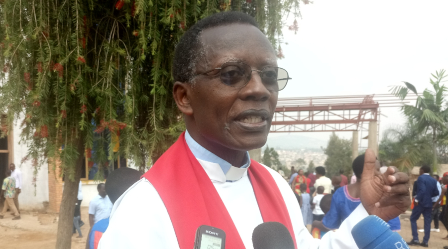 Rev. Canon Dr Antoine Rutayisire speaks to the media after the annual celebration of Anglican Churchu2019s Fatheru2019s Union at St. Peteru2019s Remera Parish yesterday. The cleric said that building strong and happy marriages and families should be taught in schools to curb the growing trend of disintegrating marriages. / Emmanuel Ntirenganya