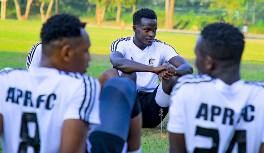 Ange Mutsinzi (background) is one of the four players APR signed from bitter rivals Rayon Sports. Courtesy.