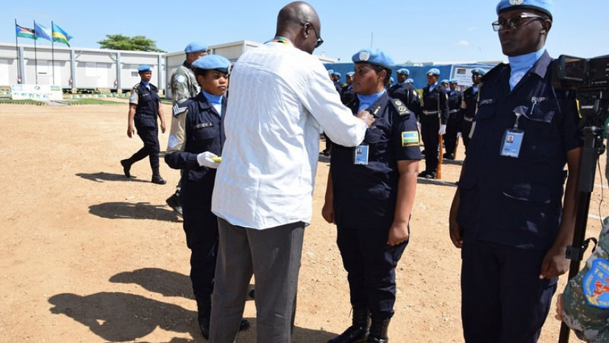 UNMISS DSRSG, Mustapha Soumare decorates RWAFPU-3 contingent commander, ACP Teddy Ruyenzi. / File