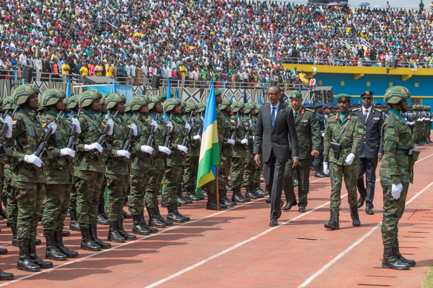 President Paul Kagame inspects a parade mounted by Rwanda Defence Force and Rwanda National Police at Amahoro National Stadium in Kigali yesterday. The Commander-In-Chief is flanked by Gen. Patrick Nyamvumba, the RDF Chief of Defence Staff, Inspector General of Police Dan Munyuza, and Brig. Gen. John Baptist Ngiruwonsanga, the head of the parade. / Village Urugwiro