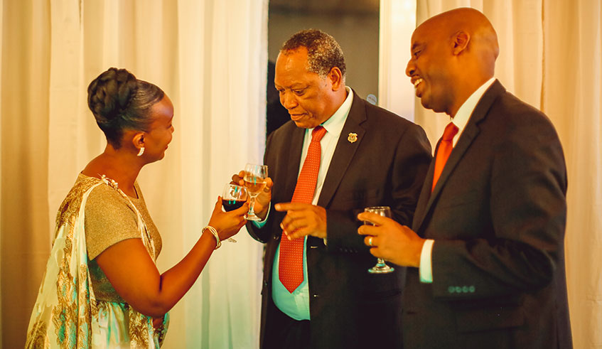 Prof Palamagamba John Aidan Mwaluko Kabudi, Tanzania's Minister for Foreign Affairs and East African Cooperation and Amb. Eugene Kayihura, Rwandau2019s envoy to Tanzania, during the Dar event to mark Rwandau2019s Liberation Silver Jubilee on Friday night.