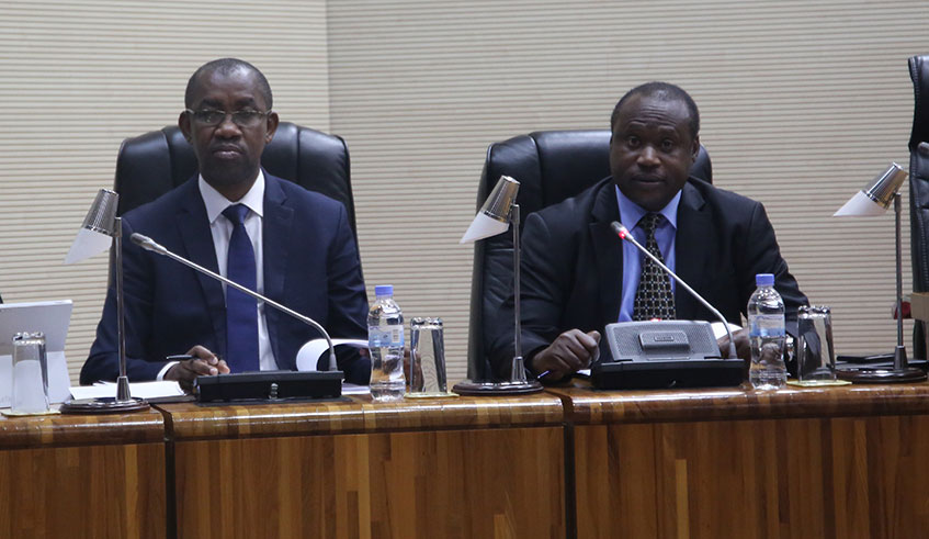 Rwanda Revenue Authority Commissioner General Pascal Ruganintwali (left) and Minister for Finance and Economic Planning, Uzziel Ndagijimana, at Parliament yesterday. Crash Bahizi.