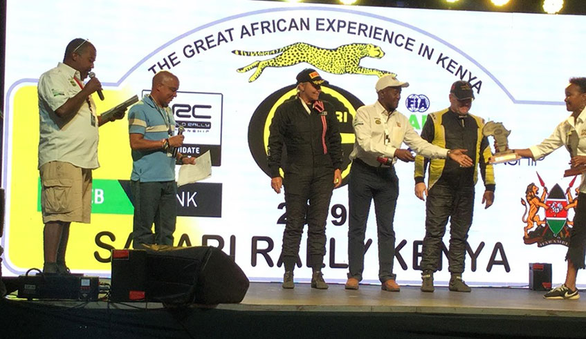 Second from right: Davite Giancarlo, a Kenyan official and navigator Sylvia Vindevogel receive thier prize awards Courtesy.