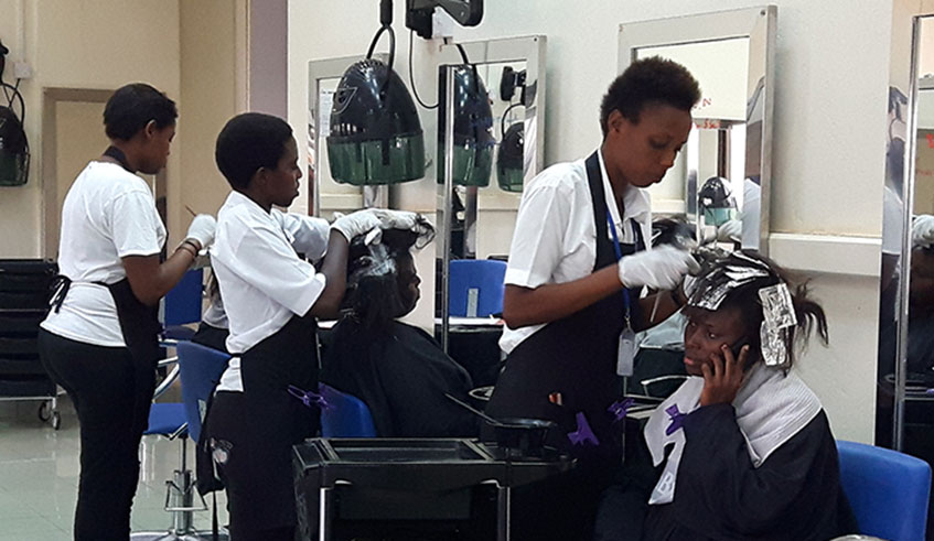 Students train in hairdressing at Share Academy. Photos by Michel Nkurunziza.